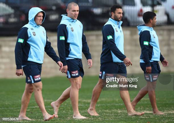 Jake Trbojevic, David Klemmer, Ryan James and Tyrone Peachey take part in a drill in bare feet during a New South Wales Blues State of Origin...