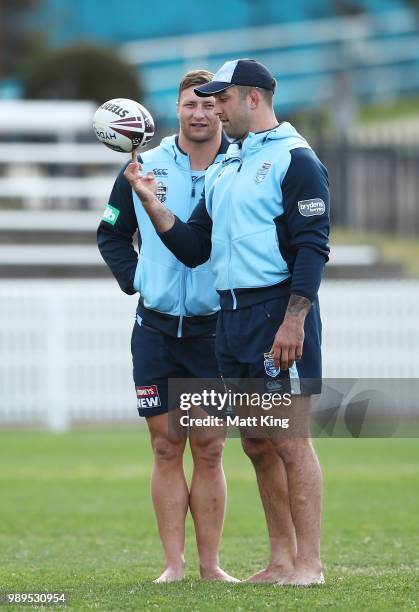 Tariq Sims and Paul Vaughan walk in bare feet during a New South Wales Blues State of Origin Recovery Session at Coogee Oval on July 2, 2018 in...