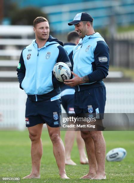 Tariq Sims and Paul Vaughan walk in bare feet during a New South Wales Blues State of Origin Recovery Session at Coogee Oval on July 2, 2018 in...