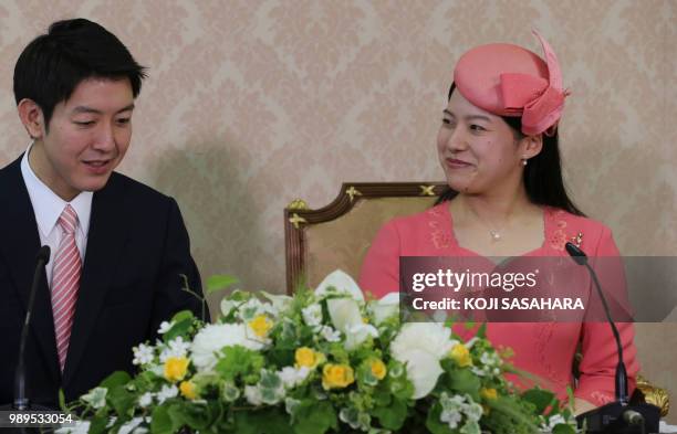 Japanese Princess Ayako , the third daughter of the late Prince Takamado, and her fiance Kei Moriya attend a press conference to announce their...