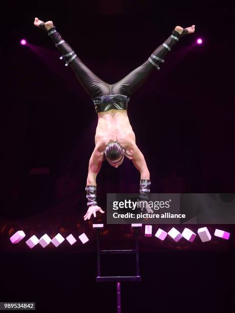 Acrobat Andre Stykan performing at the premiere of the winter programme of Circus Krone in Munich, Germany, 25 December 2017. Photo: Tobias Hase/dpa