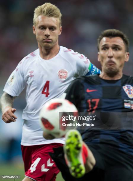 Simon Kjaer of Denmark vies Mario Mandzukic of Croatia during the 2018 FIFA World Cup Russia Round of 16 match between Croatia and Denmark at Nizhny...