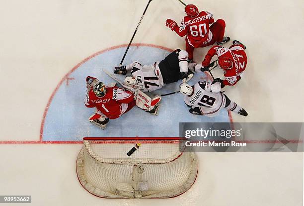 Nick Foligno of USA is tackled by Mads Christensen of Denmark during the IIHF World Championship group A match between USA and Denmark at Lanxess...