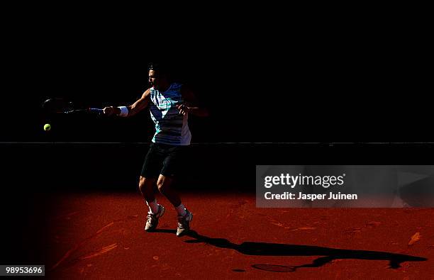 Lukasz Kubot of Poland plays the ball to Feliciano Lopez of Spain in their first round match during the Mutua Madrilena Madrid Open tennis tournament...