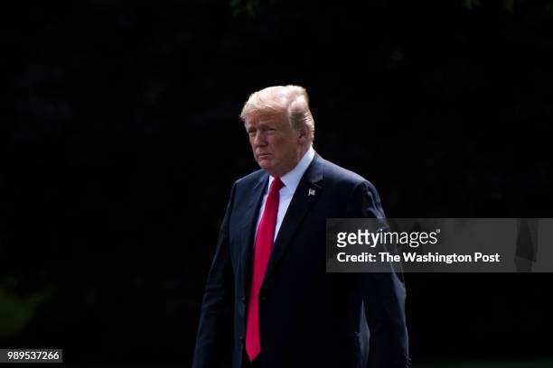 President Donald J. Trump walks from the Oval Office across the South Lawn to board Marine One at the White House on Tuesday, May 29, 2018 in...