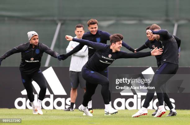 Harry Maguire of England attempts to tag Gary Cahill of England as Kyle Walker of England, Dele Alli of England and Trent Alexander-Arnold of England...