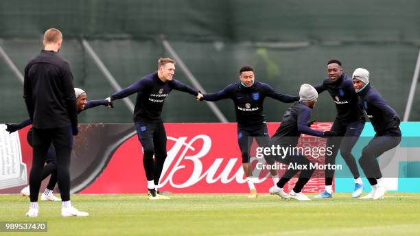 Phil Jones of England, Jesse Lingard of England, Danny Welbeck of England, Marcus Rashford of England take part in a drill during the England...