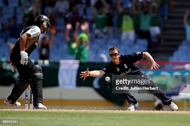 Graeme Swann of England attempts to stop a return of his bowling during the ICC World Twenty20 Super Eight match between England and New Zealand...