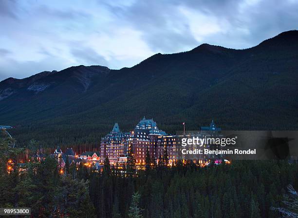 the banff springs hotel at dusk - benjamin rondel stock pictures, royalty-free photos & images