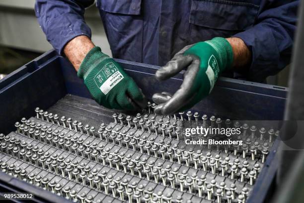 An employee checks screws at Liberty Aluminium Technologies in Coventry, U.K., on Monday, April 23, 2018. European Union leaders vowed an unwavering...