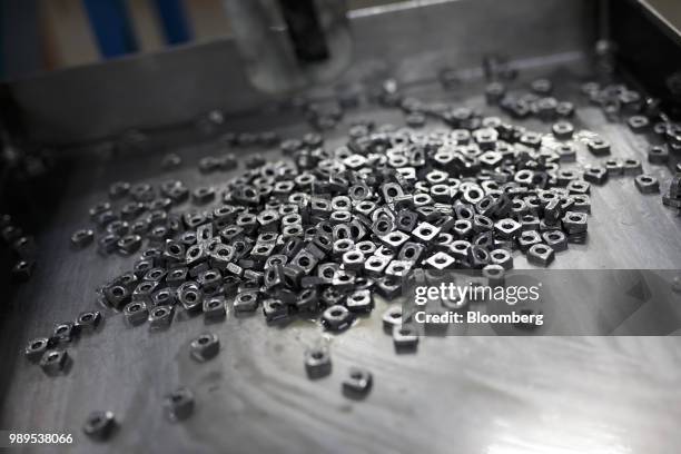 Steel nuts sit on a tray at the Leland Industries Inc. Fasteners factory in Toronto, Ontario, Canada, on Wednesday, Jan. 11, 2017. European Union...