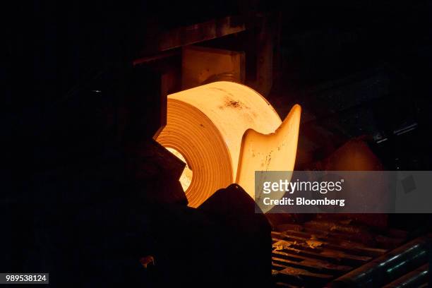 Machine rolls a steal slab into a coil at the Stelco Holdings Inc. Plant in Nanticoke, Ontario, Canada, on Tuesday, Nov. 14, 2017. European Union...