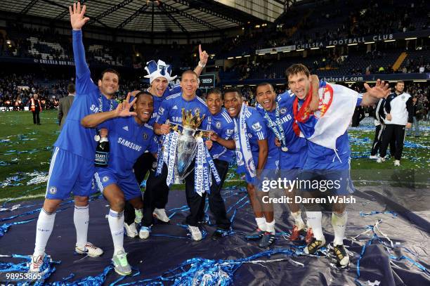 Chelsea players celebrate after winning the league with an 8-0 victory during the Barclays Premier League match between Chelsea and Wigan Athletic at...