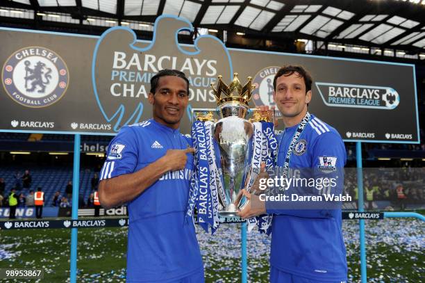 Chelsea's Florent Malouda and Juliano Belletti celebrates with the trophy after winning the league with an 8-0 victory during the Barclays Premier...