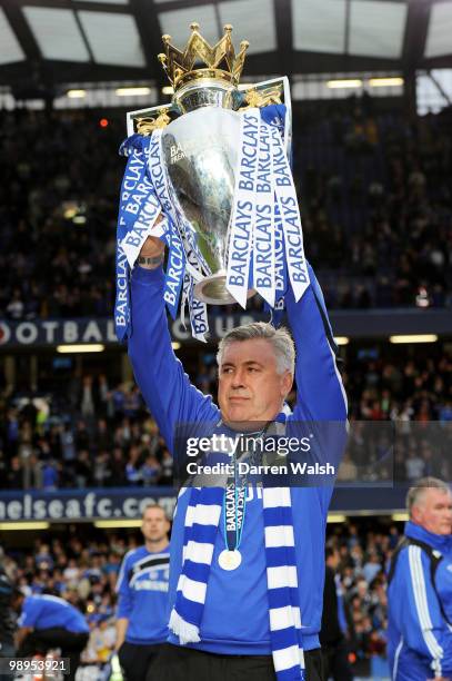 Chelsea manager Carlo Ancelotti celebrates with the trophy after winning the league with an 8-0 victory during the Barclays Premier League match...
