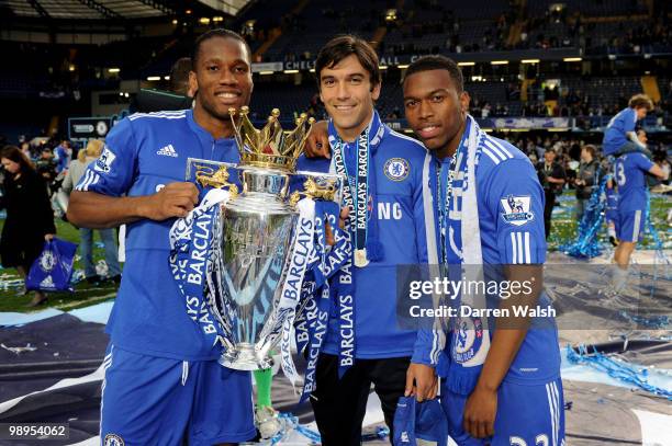 Chelsea's Didier Drogba , Paulo Ferreira and Daniel Sturridge celebrates with the trophy after winning the league with an 8-0 victory in the Barclays...