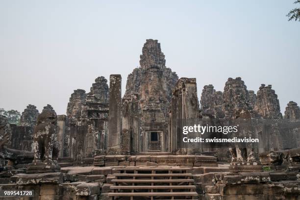 bayon temple, angkor thom in siem reap, cambodia - giant stone heads stock pictures, royalty-free photos & images