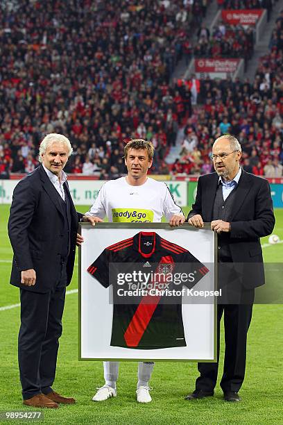 Manager Rudi Voeller and chairmann Wolfgang Holzhaeuser of Leverkusen hand out a jersey to Bernd Schneider of Schnix All Stars before the Bernd...