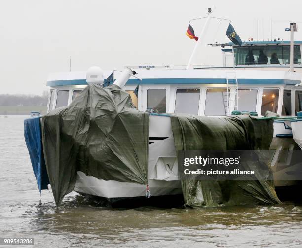 The damaged ship is tied to another ship at the dock in Duisburg, Germany, 27 December 2017. Photo: Roland Weihrauch/dpa