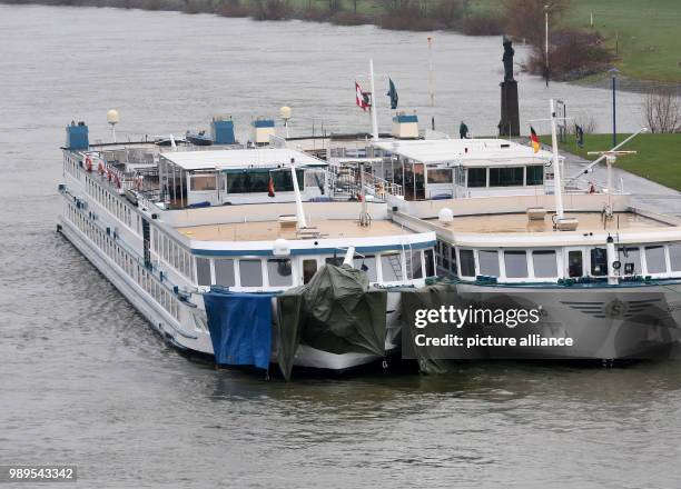 The damaged ship is tied to another ship at the dock in Duisburg, Germany, 27 December 2017. Photo: Roland Weihrauch/dpa