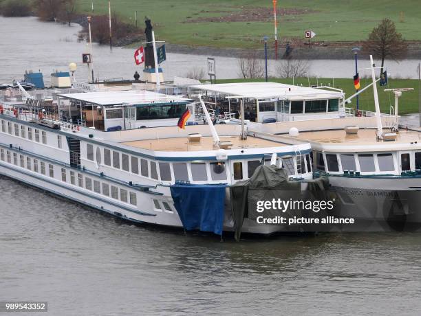 The damaged ship is tied to another ship at the dock in Duisburg, Germany, 27 December 2017. Photo: Roland Weihrauch/dpa