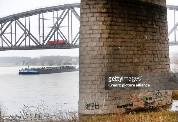 Ship floats under the bridge of the A42 road near Duisburg, Germany, 27 December 2017. An excursion ship crashed into one of the bridge's pillars...