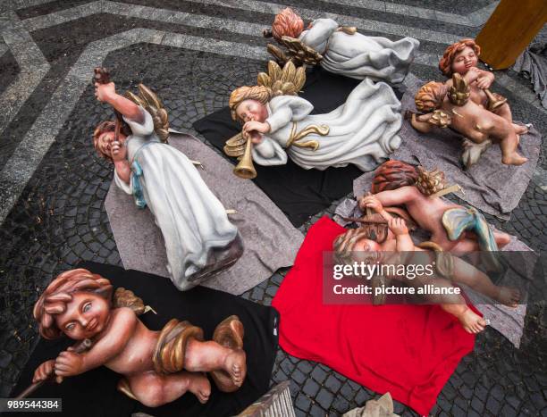 Several dismantled angels lie on the ground in Mainz, Germany, 27 December 2017. The angels are the rooftop decoration of a Christmas market stand in...