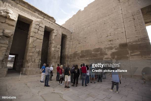 Picture provided on 28 December 2017 shows tourists visiting the Mortuary Temple of Ramesses III at Medinet Habu , in Luxor, Upper Egypt, 10 December...