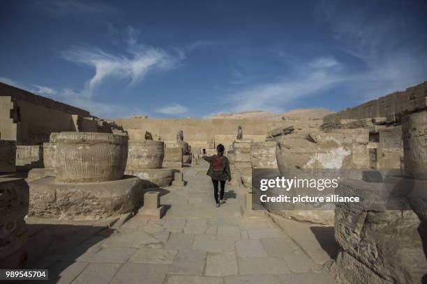 Picture provided on 28 December 2017 shows a tourist visiting the Mortuary Temple of Ramesses III at Medinet Habu , in Luxor, Upper Egypt, 10...