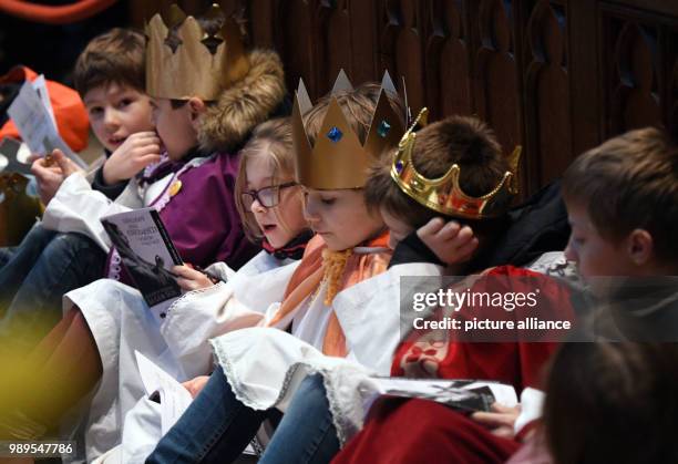 Carol singers sit during their valedictory service in the Cologne Cathedral, Germany, 28 December 2017. This year's carol singers action runs under...