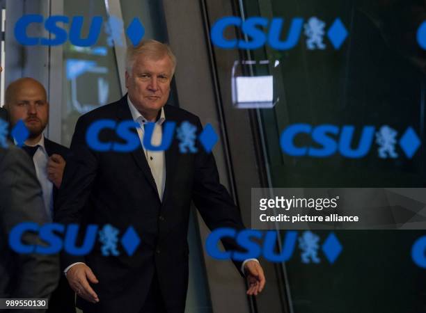 July 2018, Germany, Munich: Leader of the Christian Social Union and Minister for Domestic Affairs and Infrastructure, Horst Seehofer, leaving a CSU...