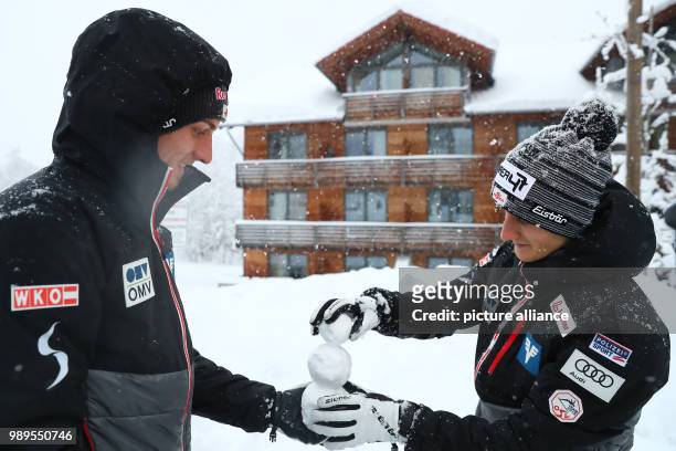 Austrian ski jumpers Gregor Schlierenzauer and Clemens Aigner build a snowman during an official photo shoot of the team for the Four Hills...
