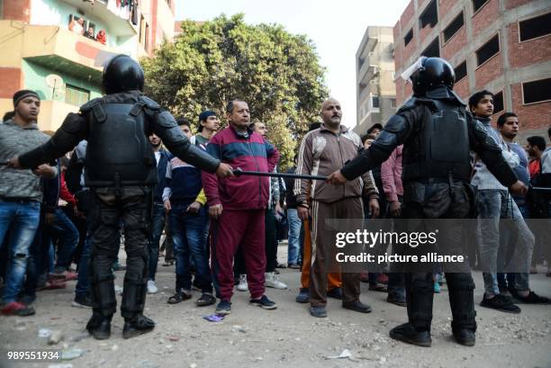 Police soldiers secure the scene of a gun attack on Mar Mina church, in Helwan, Southeastern Cairo, Egypt, 29 December 2017. At least nine people...