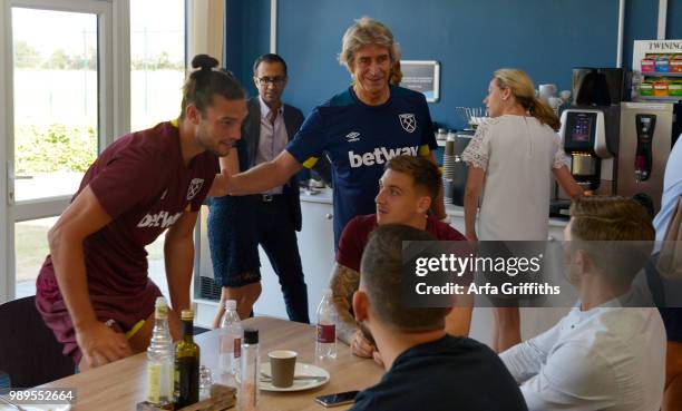 Manuel Pellegrini and Andy Carroll of West Ham United return for Pre-Season Training at Rush Green on July 2, 2018 in Romford, England.