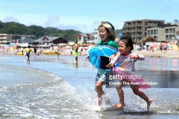 People enjoy at Zushi Beach as the beach opens for summer season on June 30, 2018 in Zushi, Kanagawa, Japan.