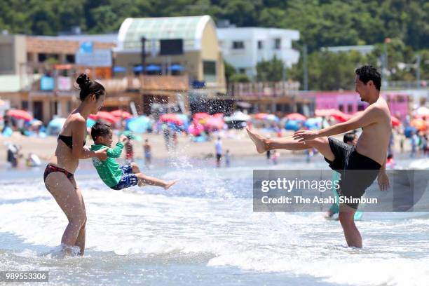 People enjoy at Zushi Beach as the beach opens for summer season on June 30, 2018 in Zushi, Kanagawa, Japan.