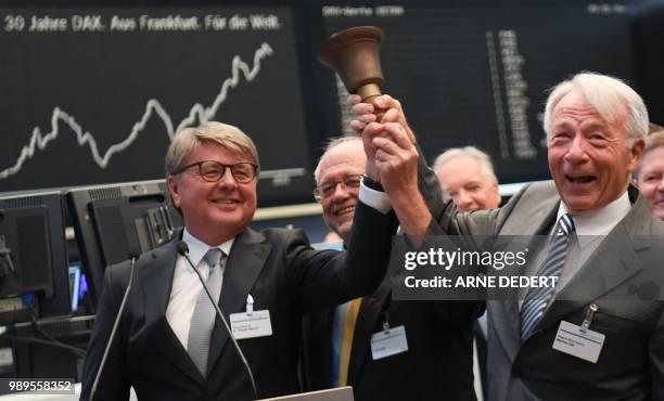 Theodor Weimer , chairman of the Deutsche Boerse AG stocks operator, and DAX-co-founders Frank Mella and Manfred Zass ring a bell in front of a board...