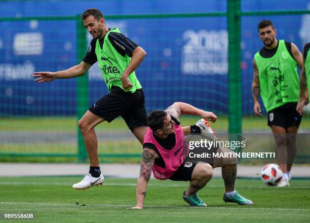 Uruguay's forward Cristhian Stuani and Uruguay's midfielder Cristian Rodriguez practice during a training session ahead of the team's quarter final...