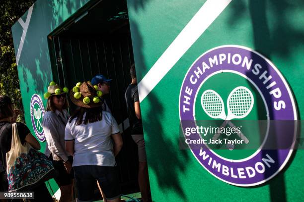 Tennis fans wait in line in the public queueing zone outside the All England Tennis Club, Wimbledon on July 2, 2018 in London, England. Thousands of...