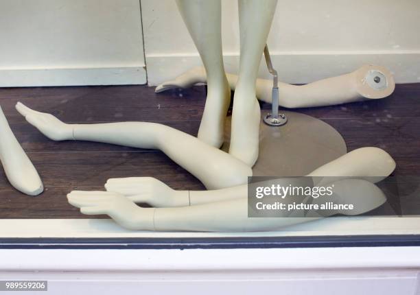 Arms of undressed mannequins lie around in the showcase of a fashion store in Duesseldorf, Germany, 29 December 2017. The fashion store at the...