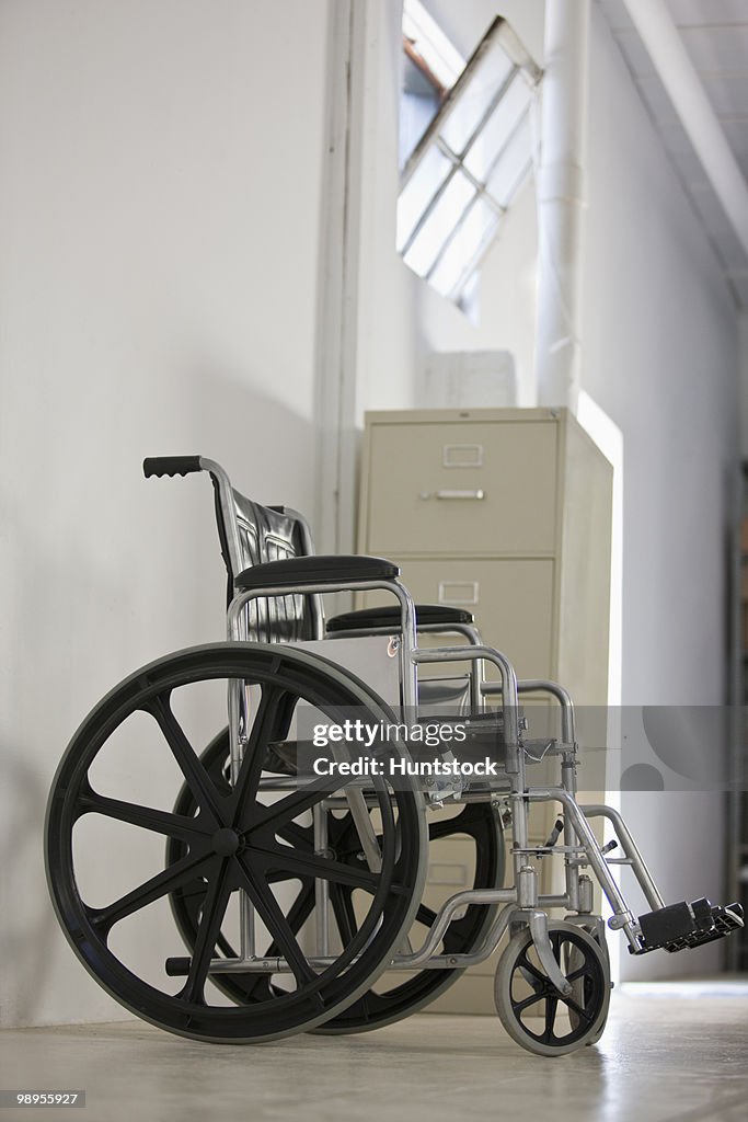 Empty wheelchair in an office