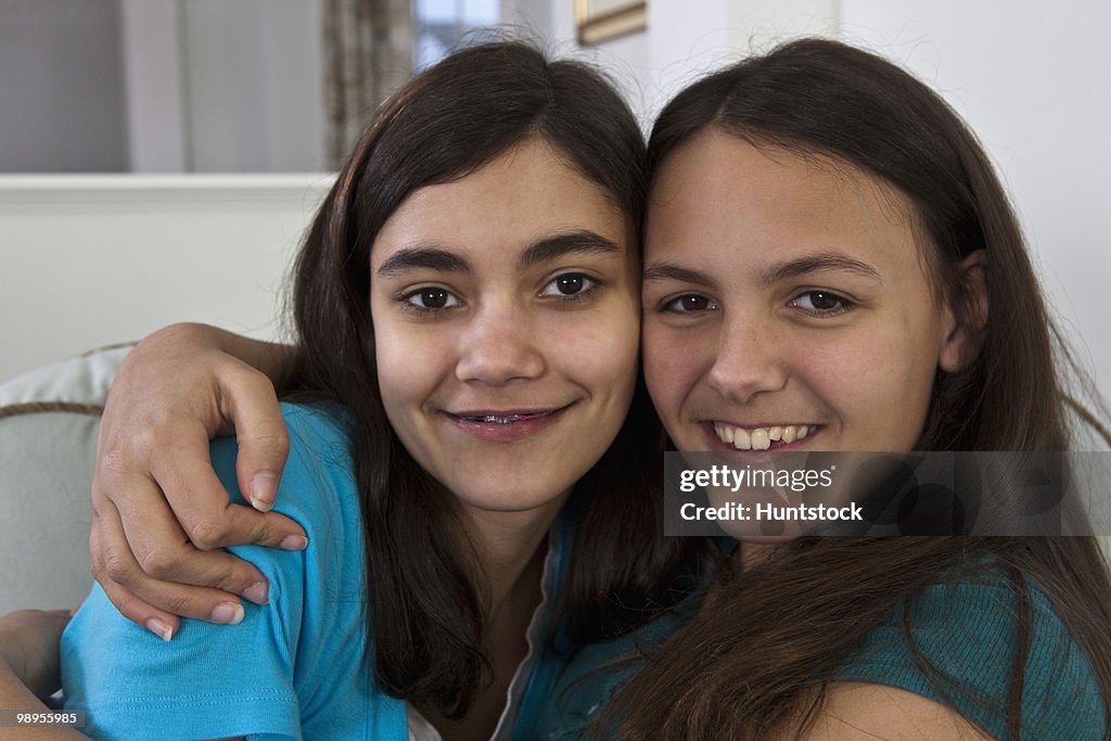 Two Hispanic teenage girls smiling