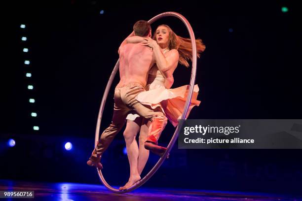 Lea and Francis of Duo Unity performing on the Cyr-Wheel at the "Feuerwerk der Turnkunst" event at the EWE-Arena in Oldenburg, Germany, 29 December...