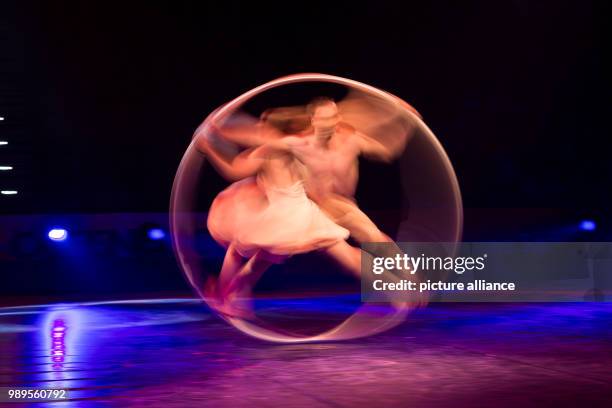 Lea and Francis of Duo Unity performing on the Cyr-Wheel at the "Feuerwerk der Turnkunst" event at the EWE-Arena in Oldenburg, Germany, 29 December...
