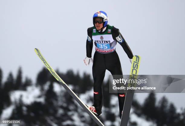 Gregor Schlierenzauer of Austria in action during the training run of the men's large hill ski jumping event at the Four Hills Tournament in...