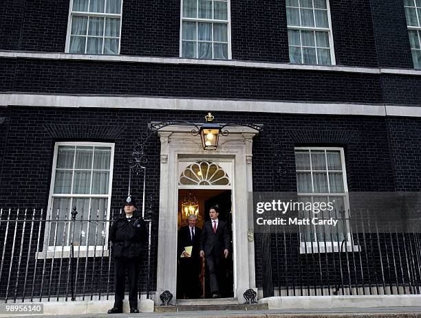 Justice Secretary Jack Straw and Foreign Secretary David Milliband leave Downing Street following a cabinet meeting on May 10, 2010 in London,...