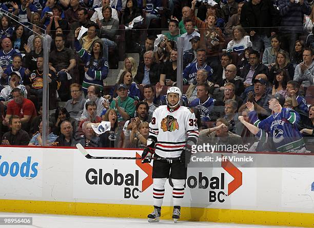 Dustin Byfuglien of the Chicago Blackhawks stands along the boards in Game Four of the Western Conference Semifinals against the Vancouver Canucks...