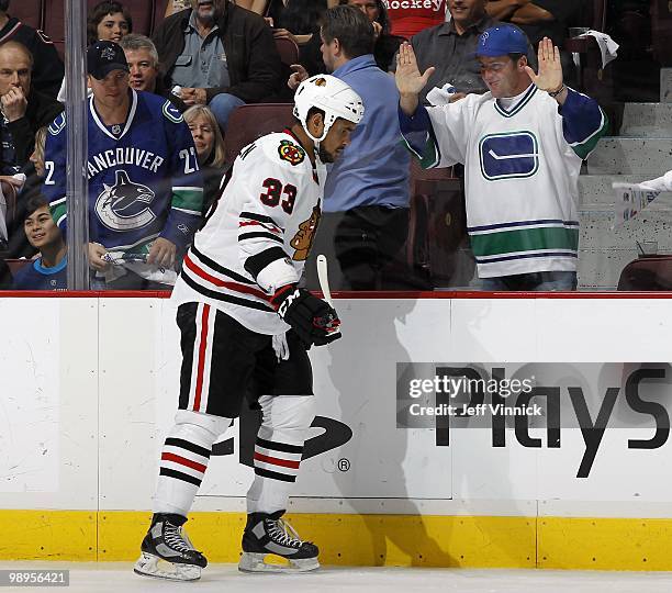 Dustin Byfuglien of the Chicago Blackhawks skates along the boards in Game Four of the Western Conference Semifinals against the Vancouver Canucks...