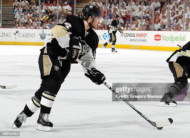 Chris Kunitz of the Pittsburgh Penguins moves the puck against the Montreal Canadiens in Game Five of the Eastern Conference Semifinals during the...