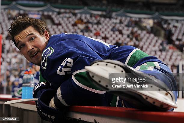 Shane O'Brien of the Vancouver Canucks stretches on the bench in Game Four of the Western Conference Semifinals against the Chicago Blackhawks during...